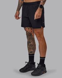 Man wearing Challenger 6" Performance Shorts in Black | Size:S | Thumbnail Index: 4