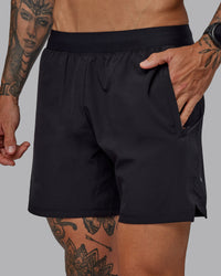 Man wearing Challenger 6" Performance Shorts in Black | Size:S | Thumbnail Index: 2