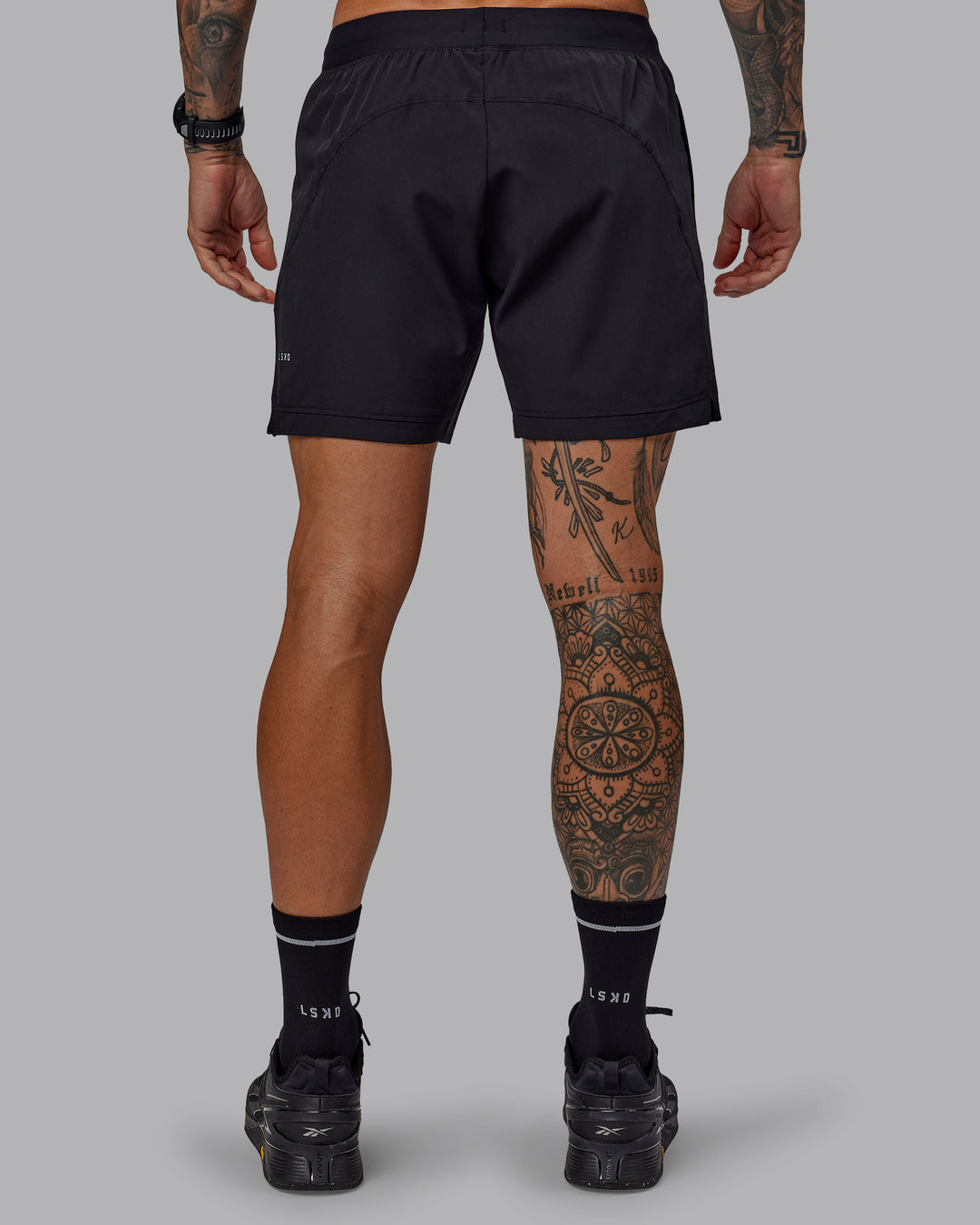 Man wearing Challenger 6" Performance Shorts in Black | Size:S - view 4