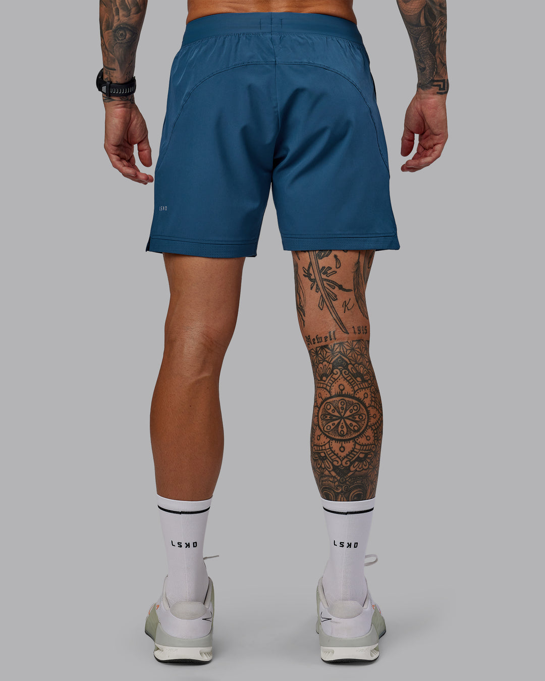 Man wearing Challenger 6" Performance Short in Indigo | Size:S - view 4
