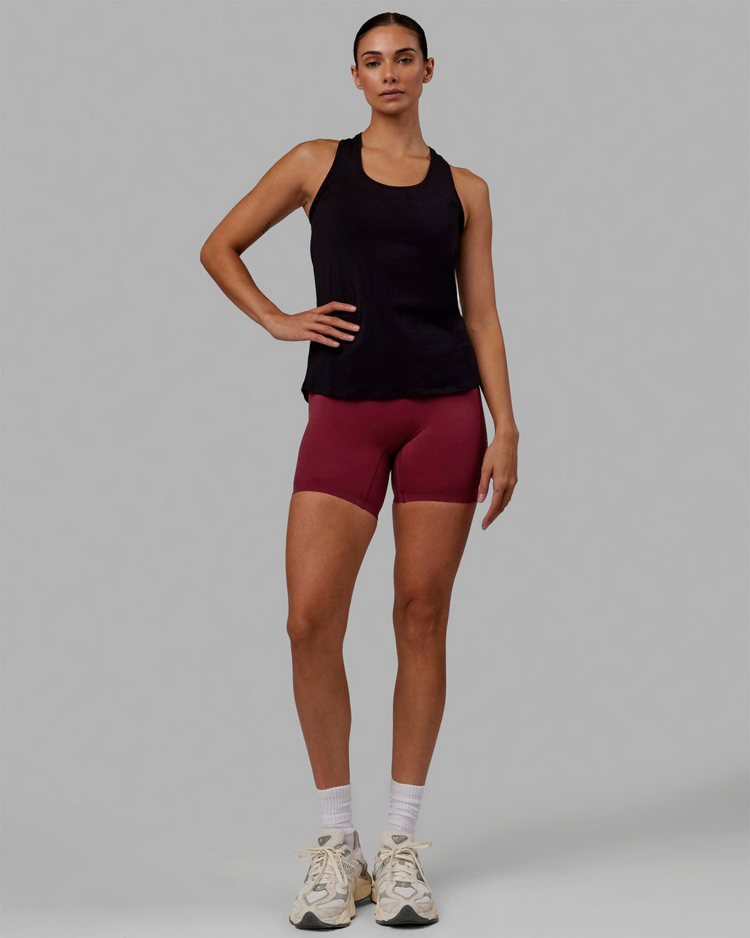 Woman wearing Charge PimaFLX-Lite Active Tank - Black - view 1