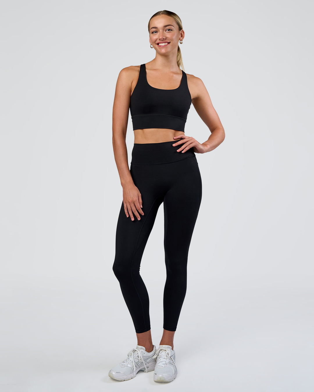Woman wearing Circuit Longline Sports Bra - Black | Model:Evie | Size:S - view 3