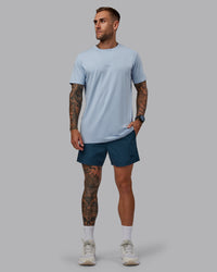 Man wearing Daily 5" Shorts - Indigo | Thumbnail Index: 4
