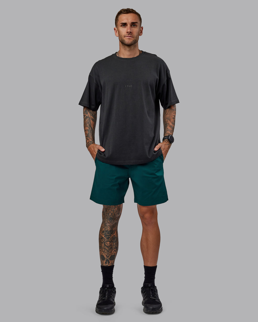 Man wearing Daily 7" Shorts - Dark Moss - view 2