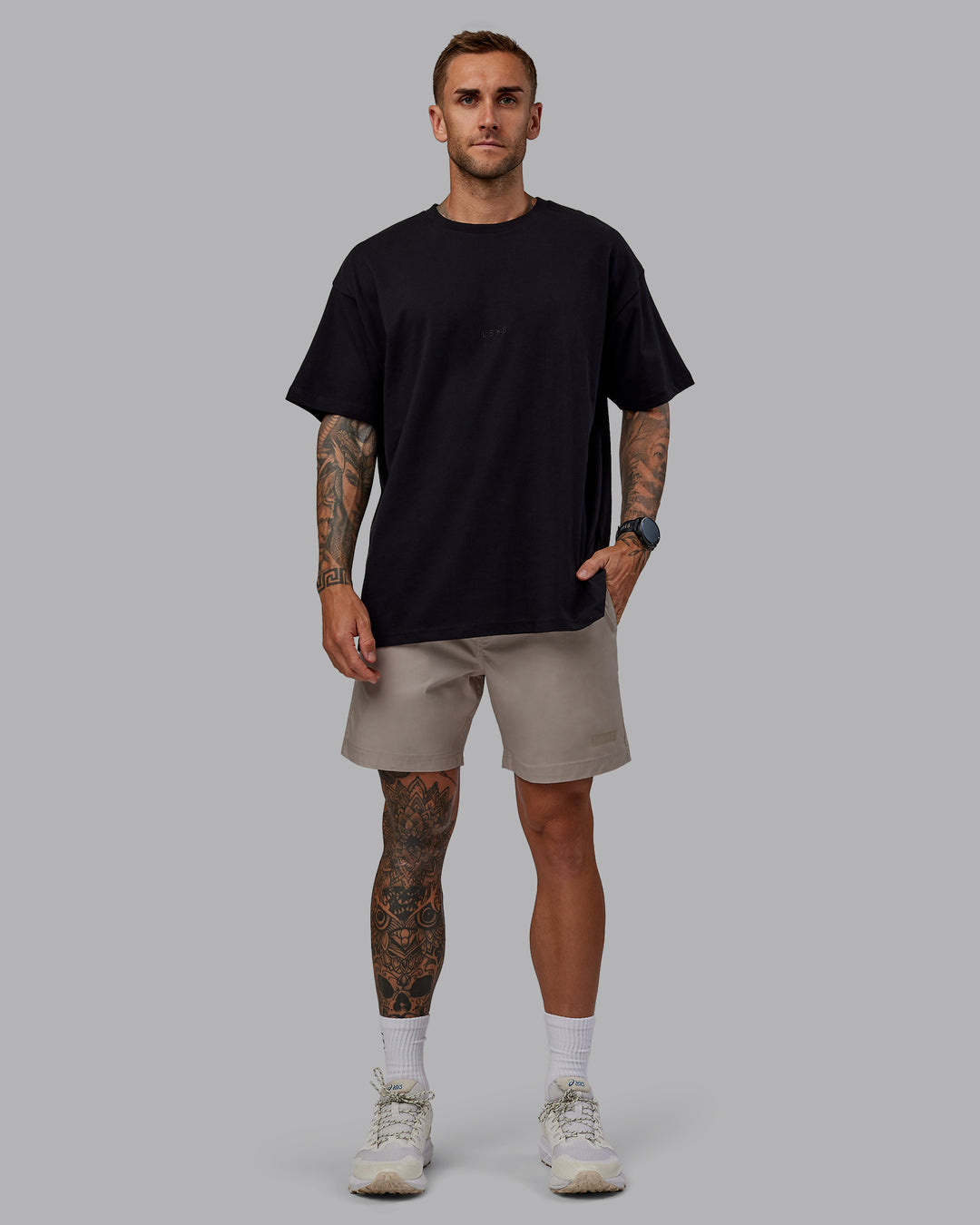 Man wearing Daily 7" Shorts - Shale Beige - view 5