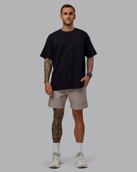Man wearing Daily 7" Shorts - Shale Beige | Thumbnail Index: 4