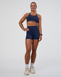 Woman wearing Distinction Sports Bra 2.0 - Future Navy-Baltic Sea | Model:Sav | Size:S | Thumbnail Index: 2