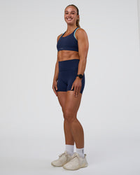 Woman wearing Distinction Sports Bra 2.0 - Future Navy-Baltic Sea | Model:Sav | Size:S | Thumbnail Index: 6