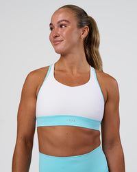 Woman wearing Distinction Sports Bra 2.0 - White-Baltic Sea | Model:Sav | Size:S | Thumbnail Index: 0
