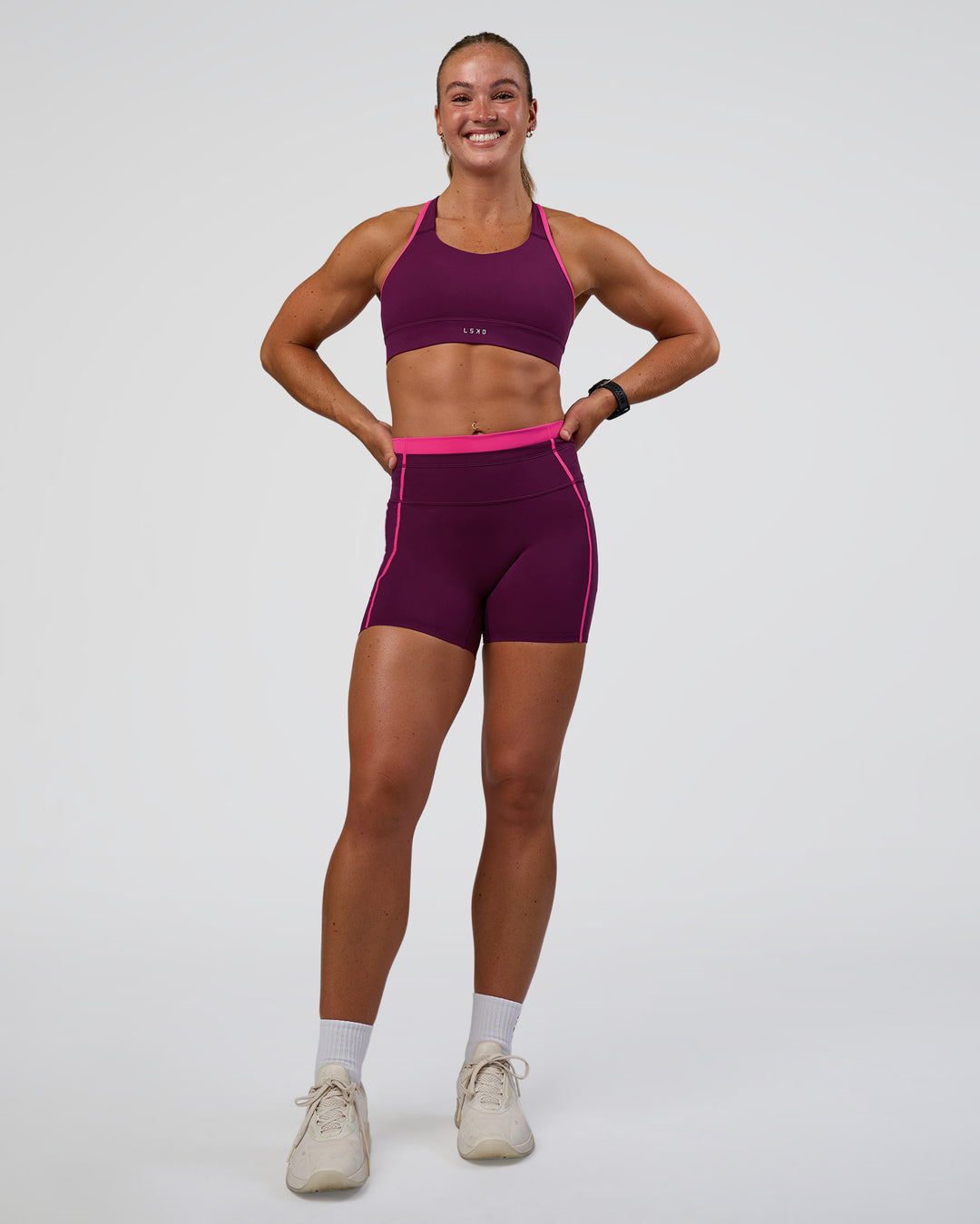 Woman wearing Distinction Sports Bra 2.0 - Plum Caspia-Ultra Pink | Model:Sav | Size:S - view 3