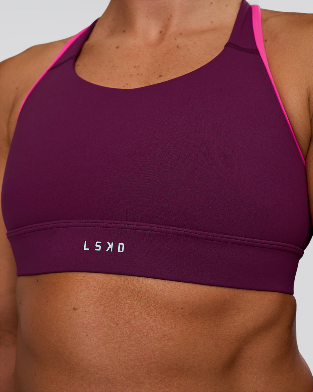 Woman wearing Distinction Sports Bra 2.0 - Plum Caspia-Ultra Pink | Model:Sav | Size:S - view 4