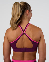 Woman wearing Distinction Sports Bra 2.0 - Plum Caspia-Ultra Pink | Model:Sav | Size:S | Thumbnail Index: 1