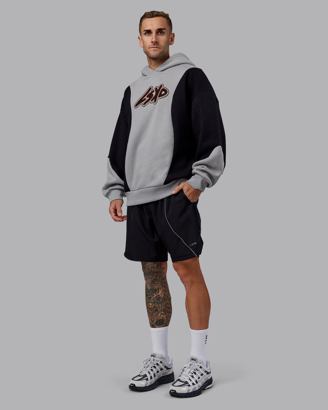 Man wearing Downtown Oversized Panel Hoodie - Circular Grey - Black | Model:Tommy | Size:S - view 6