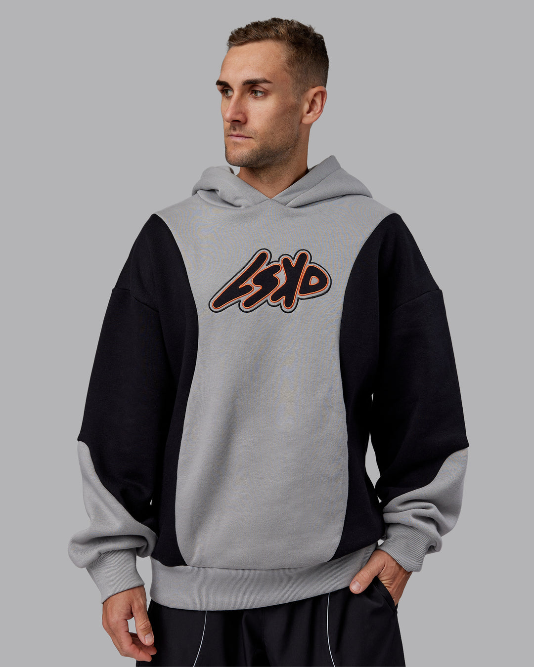 Man wearing Downtown Oversized Panel Hoodie - Circular Grey - Black | Model:Tommy | Size:S - view 2