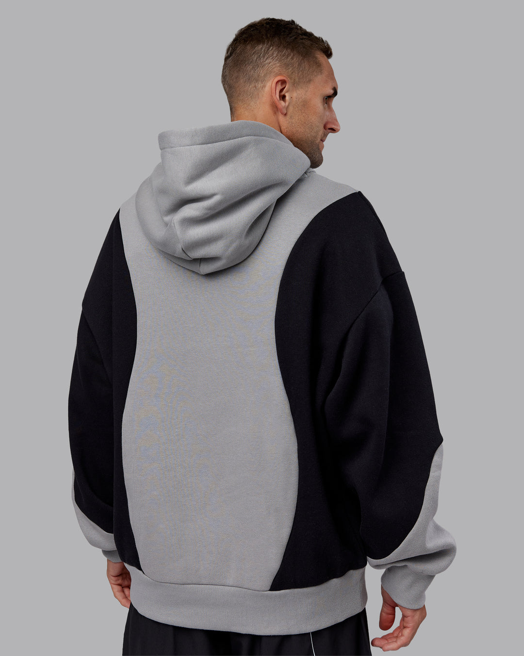 Man wearing Downtown Oversized Panel Hoodie - Circular Grey - Black | Model:Tommy | Size:S - view 4