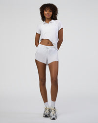 Woman wearing Drive Polo - White | Model:Tomi | Size:S | Thumbnail Index: 4