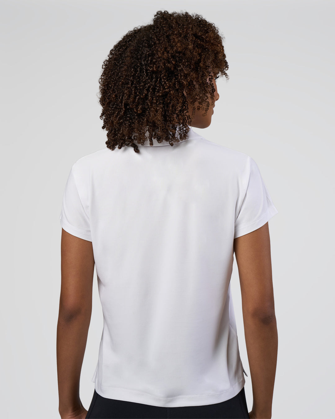Woman wearing Drive Polo - White | Model:Tomi | Size:S - view 4