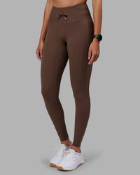 Woman wearing Effortless Drawstring Ultra High-Rise Full Length Legging Pockets - Chocolate Martini | Model:Rhiley | Size:S | Thumbnail Index: 0