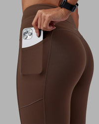 Woman wearing Effortless Drawstring Ultra High-Rise Full Length Legging Pockets - Chocolate Martini | Model:Rhiley | Size:S | Thumbnail Index: 2