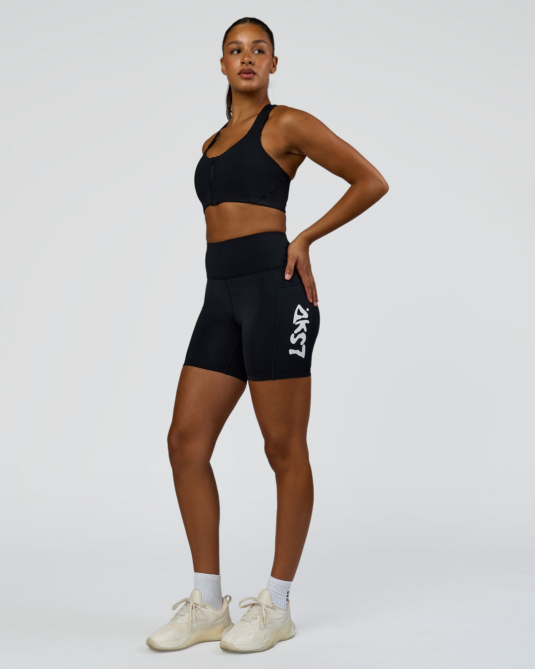 Woman wearing Elarra Zip Front Sports Bra - Black | Model:Rosie | Size:S - view 4