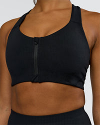 Woman wearing Elarra Zip Front Sports Bra - Black | Model:Rosie | Size:S | Thumbnail Index: 5