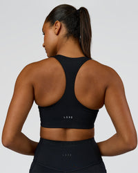 Woman wearing Elarra Zip Front Sports Bra - Black | Model:Rosie | Size:S | Thumbnail Index: 2