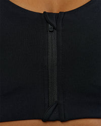 Woman wearing Elarra Zip Front Sports Bra - Black | Model:Rosie | Size:S | Thumbnail Index: 1