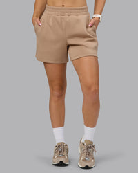 Woman wearing Elevate SoftTouch 4" Short - Light Taupe | Model:Halle | Size:S | Thumbnail Index: 2