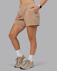 Woman wearing Elevate SoftTouch 4" Short - Light Taupe | Model:Halle | Size:S | Thumbnail Index: 5