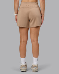 Woman wearing Elevate SoftTouch 4" Short - Light Taupe | Model:Halle | Size:S | Thumbnail Index: 3