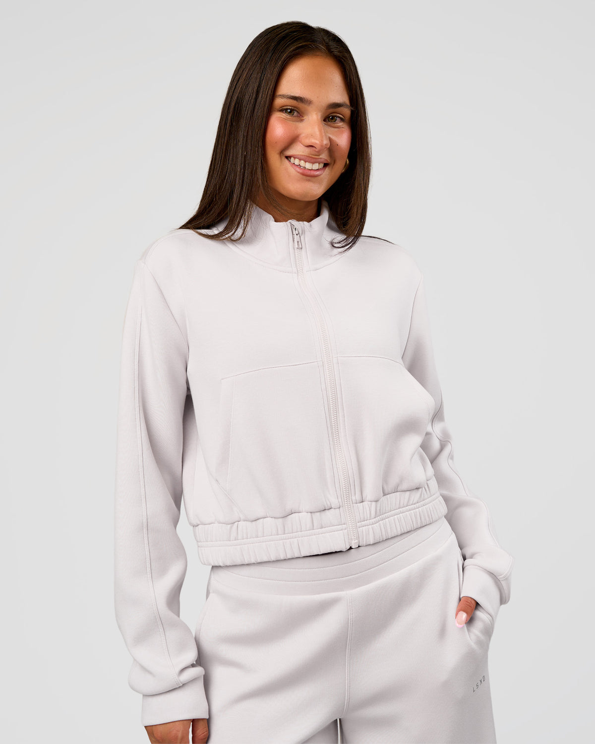 Woman wearing Elevate SoftTouch Cropped Full Zip Jacket - Clay | Model:Bianca | Size:S