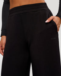 Woman wearing Elevate SoftTouch Wide Leg Pant Tall - Black | Model:Bianca | Size:S | Thumbnail Index: 2