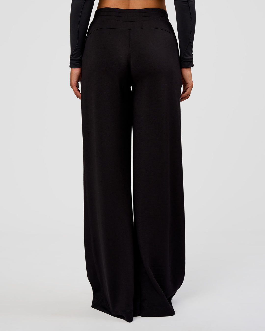 Woman wearing Elevate SoftTouch Wide Leg Pant Tall - Black | Model:Bianca | Size:S - view 4