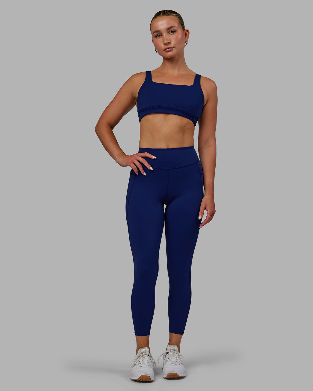 Woman wearing Elite High-Rise 7/8 Legging Pockets - Midnight Blue - view 5
