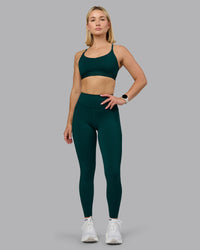 Woman wearing Elite High-Rise Full Length Legging Pockets - Dark Moss | Model:Halle | Size:S | Thumbnail Index: 1