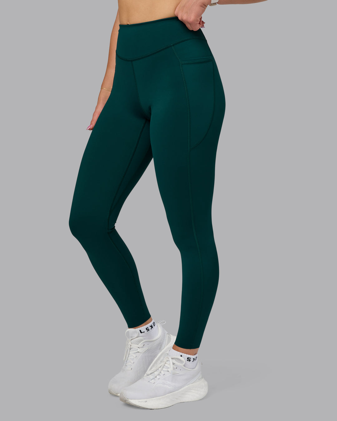Woman wearing Elite High-Rise Full Length Legging Pockets - Dark Moss | Model:Halle | Size:S - view 1
