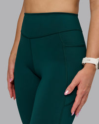 Woman wearing Elite High-Rise Full Length Legging Pockets - Dark Moss | Model:Halle | Size:S | Thumbnail Index: 6