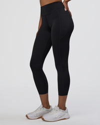 Woman wearing Elite High-Rise 7/8 Legging Pockets - Black | Model:Jordan | Size:S | Thumbnail Index: 1