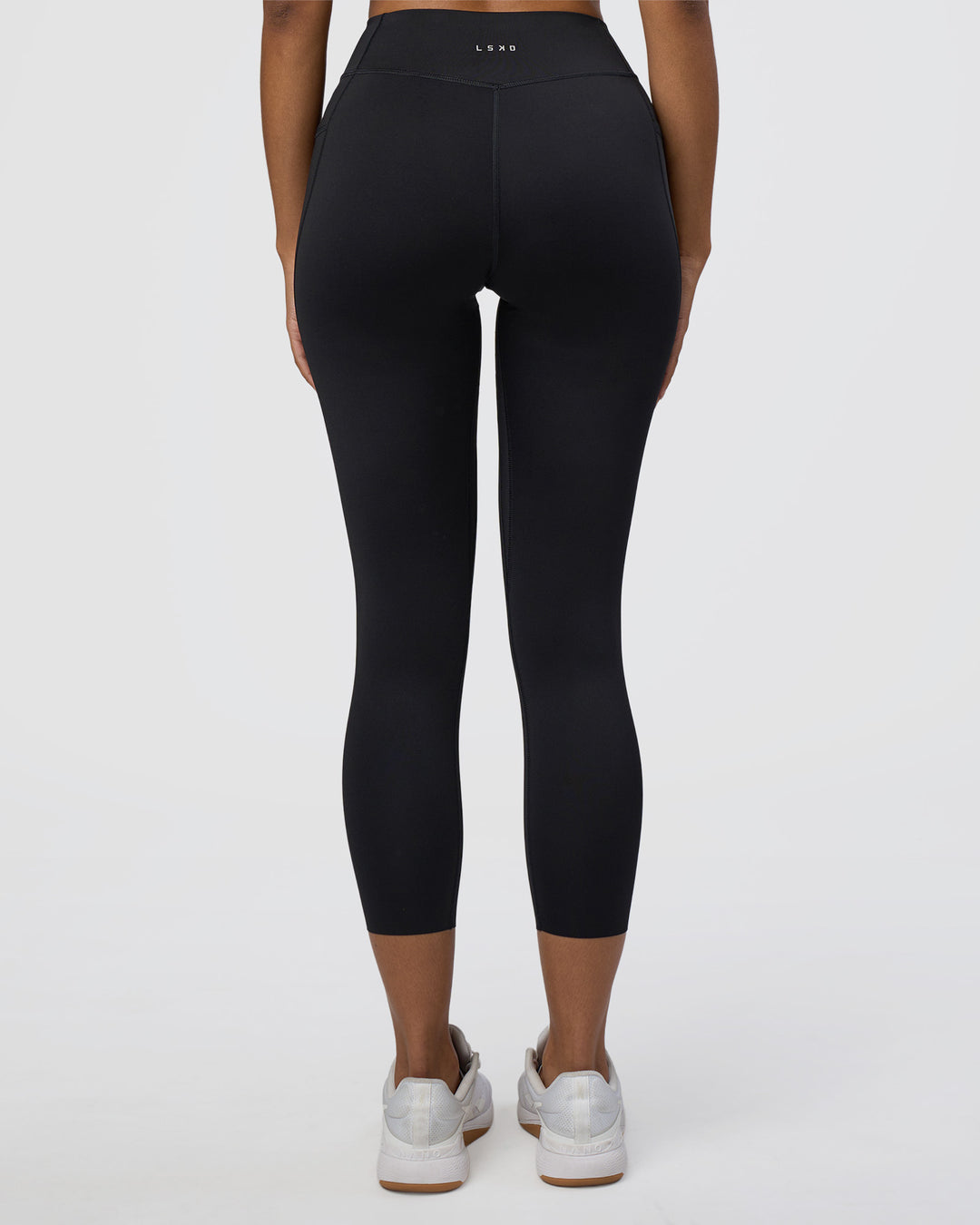 Woman wearing Elite High-Rise 7/8 Legging Pockets - Black | Model:Jordan | Size:S - view 4