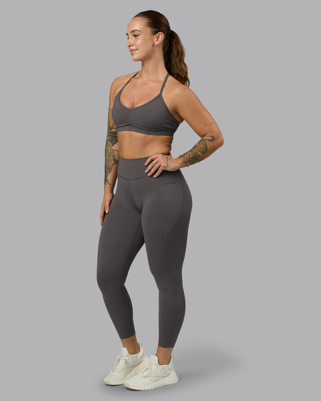 Woman wearing Elite High-Rise 7/8 Legging Pockets - Dark Storm | Model:Robyn | Size:S - view 7