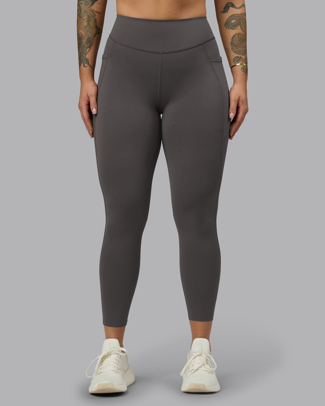 Woman wearing Elite High-Rise 7/8 Legging Pockets - Dark Storm | Model:Robyn | Size:S - view 5
