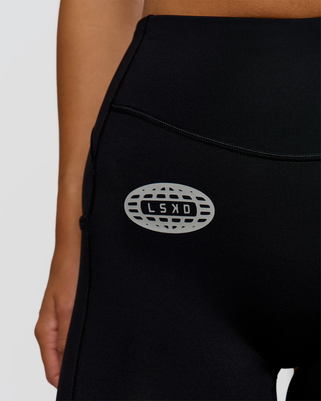 Woman wearing Elite Hype Reflective Run High-Rise 5" Short Pockets - Black-Hype Reflective | Model:Amity | Size:S - view 11