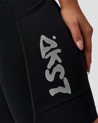 Woman wearing Elite Hype Reflective Run High-Rise 7" Short Pockets - Black-Hype Reflective | Model:Sophia | Size:S | Thumbnail Index: 10