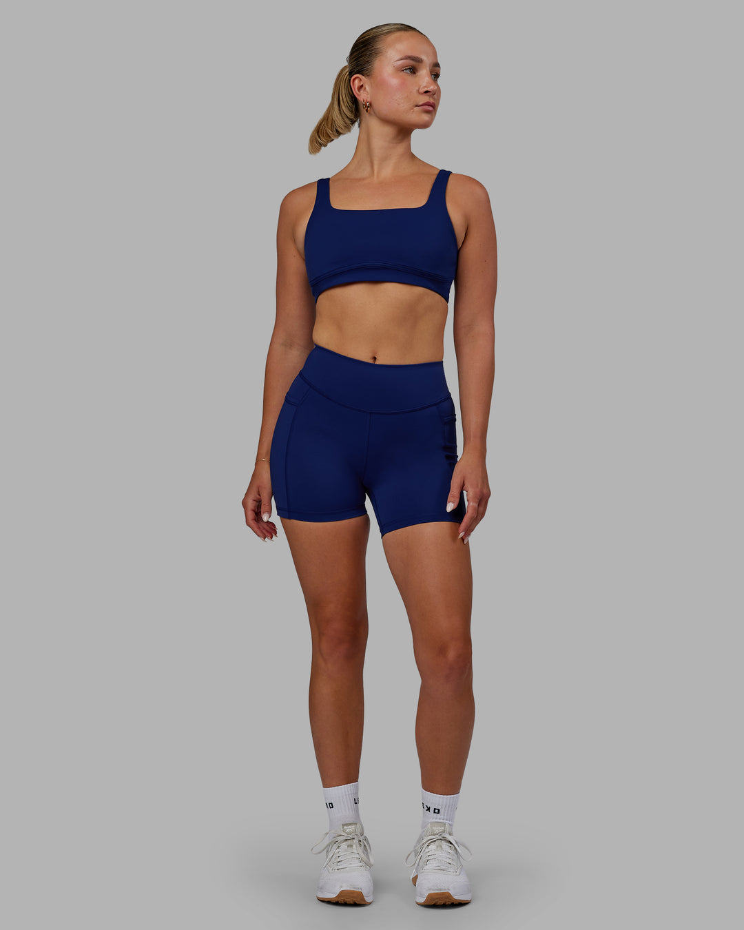 Woman wearing Elite High-Rise 4" Short Pockets - Midnight Blue - view 5