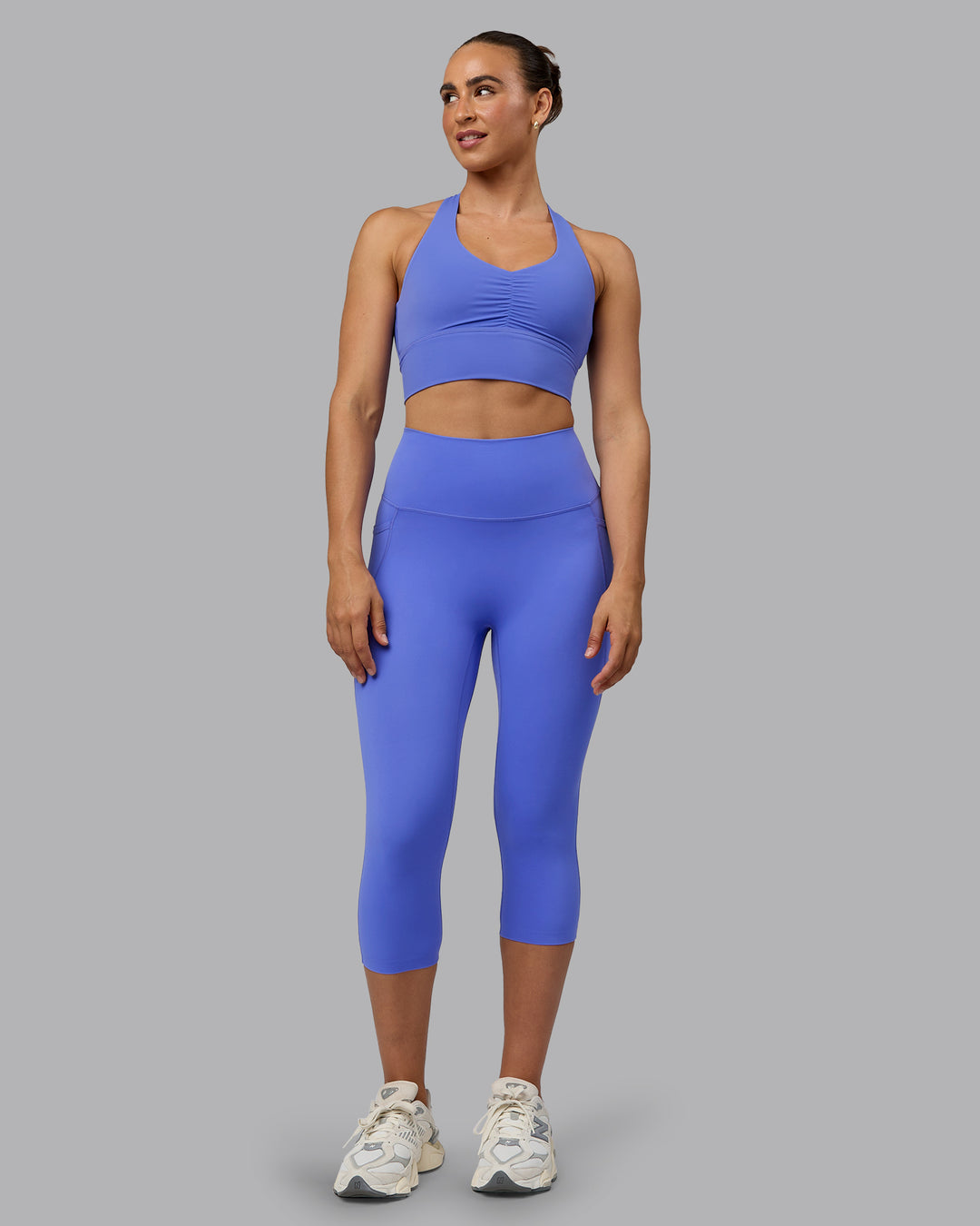 Woman wearing Elixir Ultra High-Rise 3/4 Legging Pockets - Baja Blue | Model:Sophie | Size:S - view 5