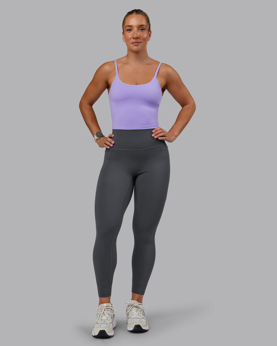Woman wearing Elixir Ultra High-Rise 7/8 Legging Pockets - Dark Storm | Model:Lyss | Size:S - view 1