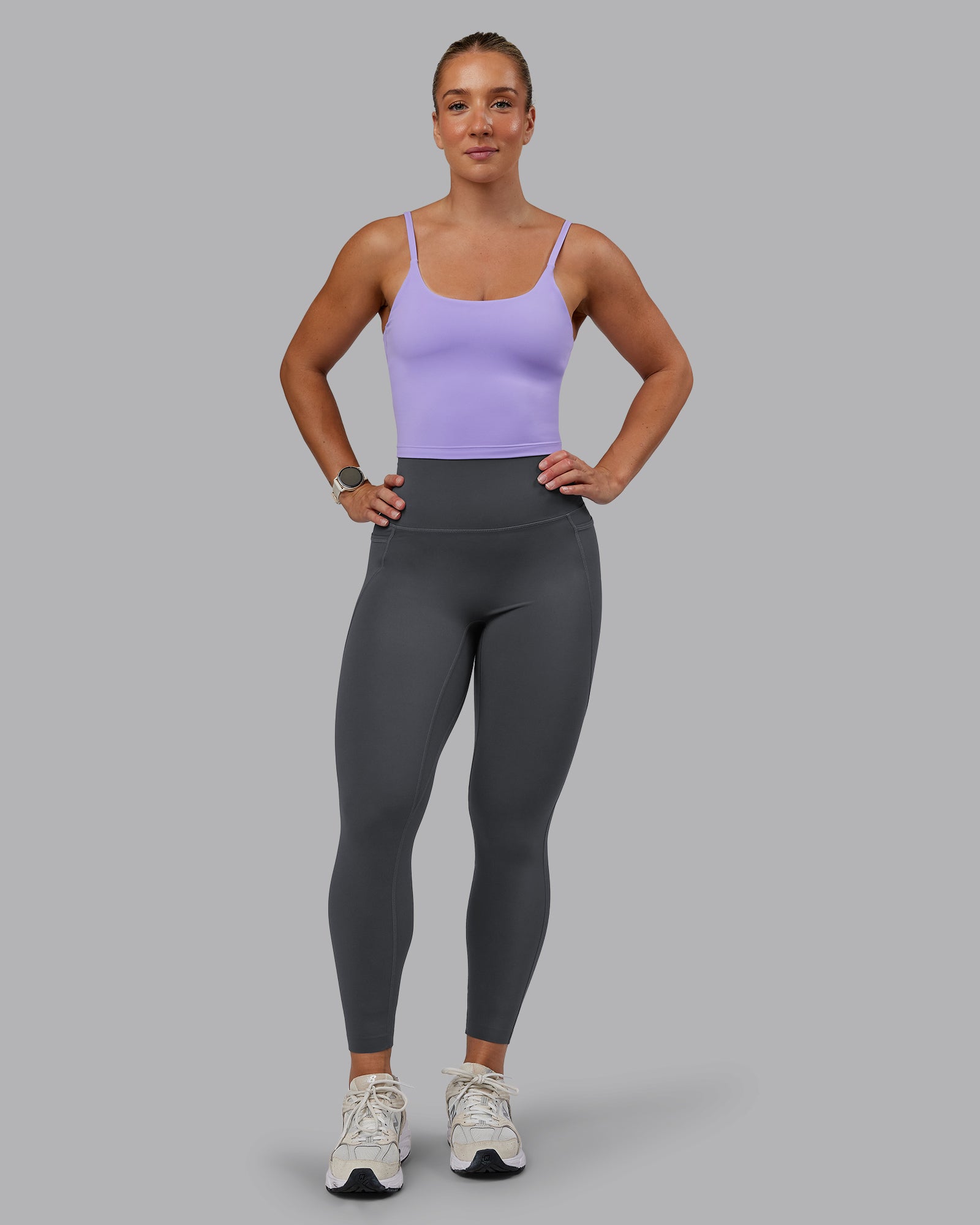 Woman wearing Elixir Ultra High-Rise 7/8 Legging Pockets - Dark Storm | Model:Lyss | Size:S