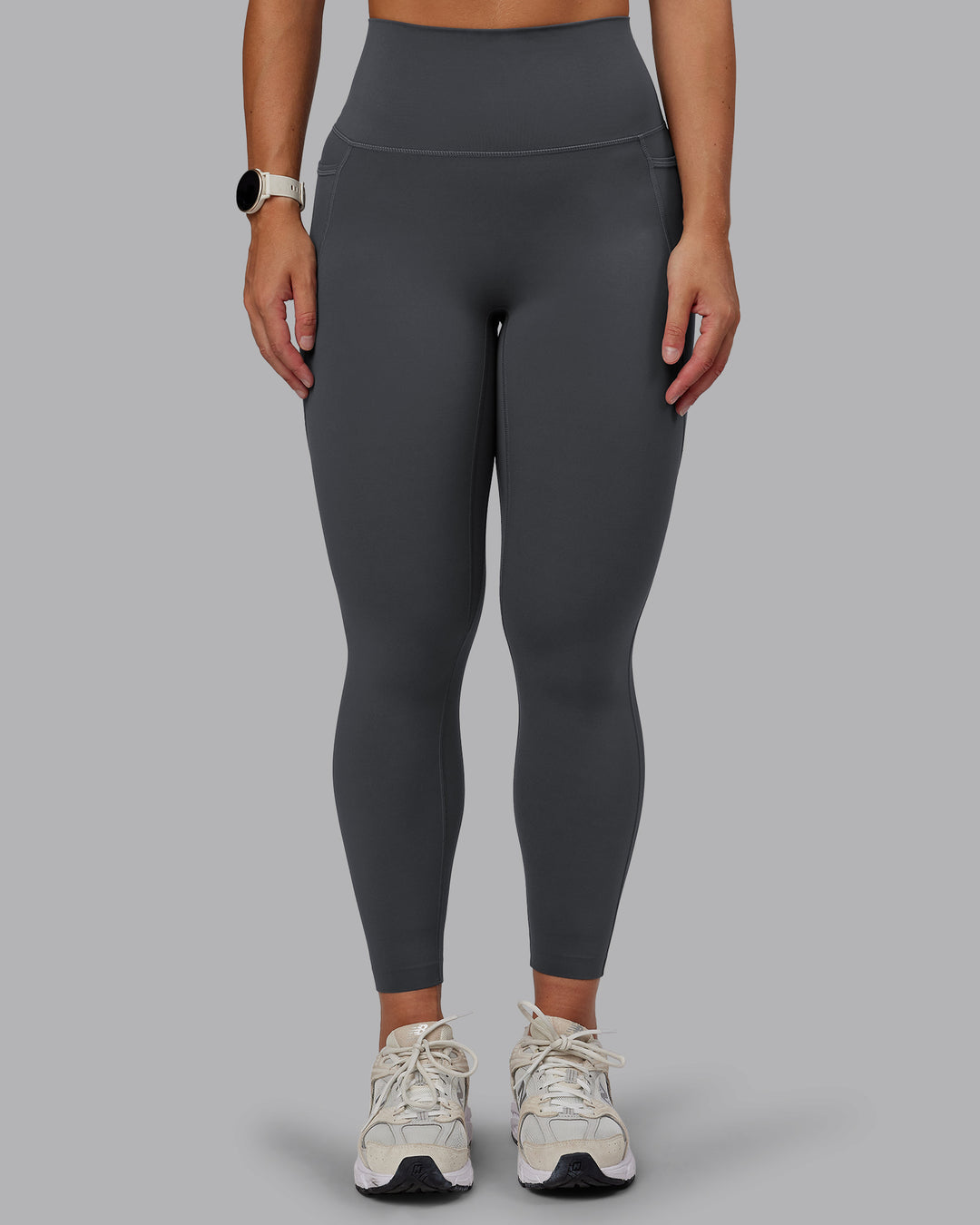 Woman wearing Elixir Ultra High-Rise 7/8 Legging Pockets - Dark Storm | Model:Lyss | Size:S - view 2