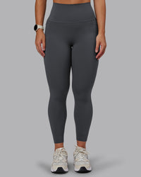 Woman wearing Elixir Ultra High-Rise 7/8 Legging Pockets - Dark Storm | Model:Lyss | Size:S | Thumbnail Index: 1
