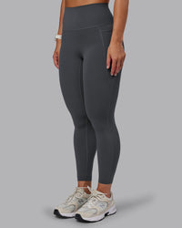 Woman wearing Elixir Ultra High-Rise 7/8 Legging Pockets - Dark Storm | Model:Lyss | Size:S | Thumbnail Index: 5